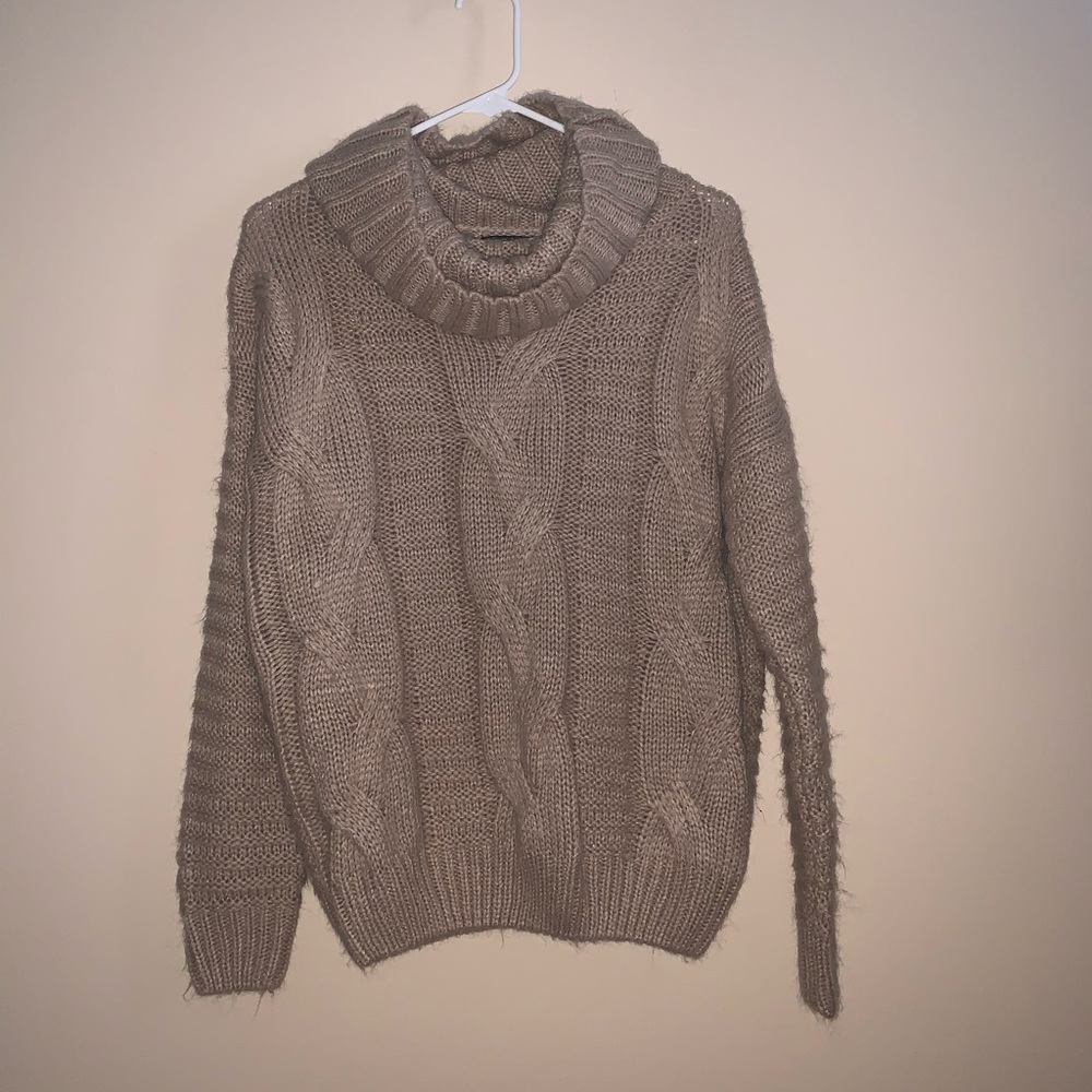 Soft, loose turtle neck sweater.